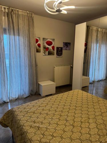 a bedroom with a large bed and a window at "Casa Viola" via Camillo CARLOMAGNO 26 in Isernia