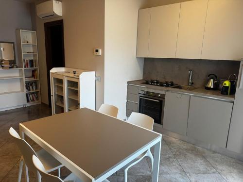 a kitchen with a table and chairs in it at "Casa Viola" via Camillo CARLOMAGNO 26 in Isernia