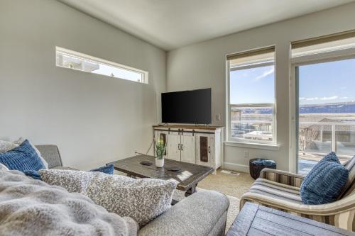 a living room with a couch and a tv at The River View on Riverview Way in Quincy