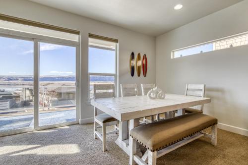 a dining room with a table and chairs and windows at The River View on Riverview Way in Quincy
