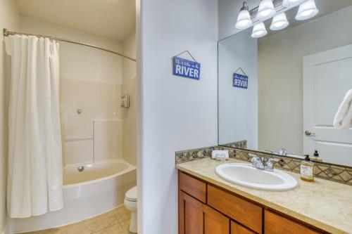 a bathroom with a sink and a tub and a toilet at The River View on Riverview Way in Quincy