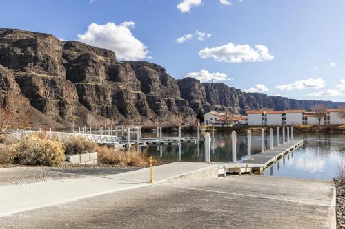 a dock with a mountain in the background at The River View on Riverview Way in Quincy