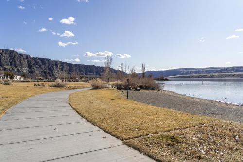 a wooden path next to a body of water at The River View on Riverview Way in Quincy