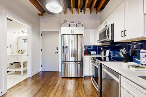 a kitchen with a stainless steel refrigerator at All Access Pass #104 in Nashville