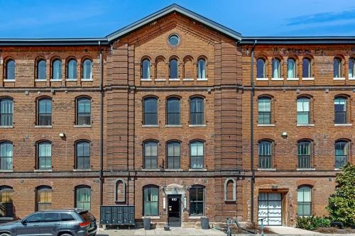 a large brick building with a car parked in front at All Access Pass #104 in Nashville