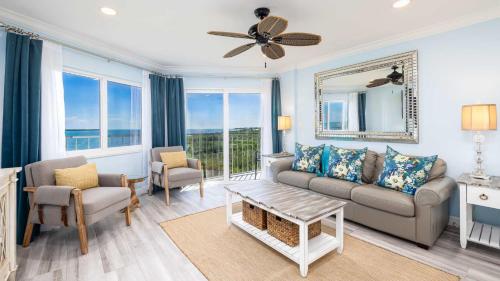 a living room with a couch and a table at Ocean View Treehouse Double King Suite 3403 in Tavernier