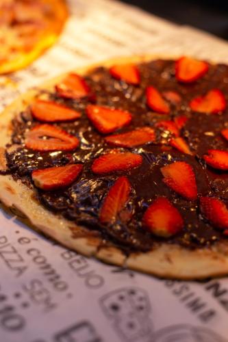 a chocolate dessert with strawberries on top of it at B&B HOTEL São Paulo Luz - Centro in Sao Paulo