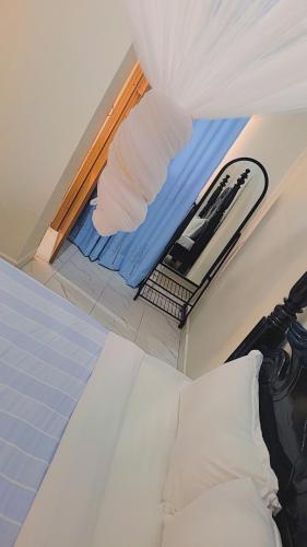 Opamu Homes Entebbeにあるベッド