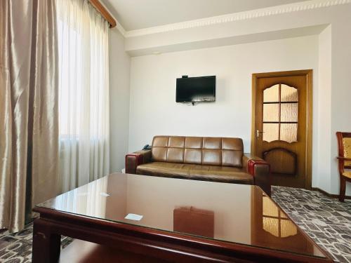 a living room with a couch and a table at SD Hotel in Yerevan