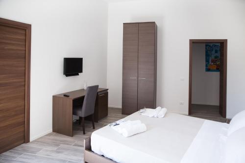 Кровать или кровати в номере Apartments Porta di Castro