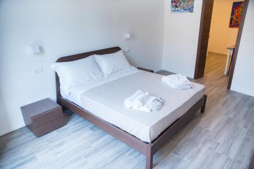 Кровать или кровати в номере Apartments Porta di Castro