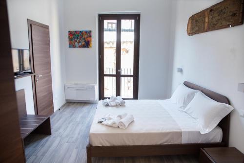Кровать или кровати в номере Apartments Porta di Castro