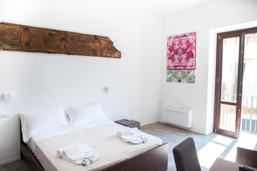 Кровать или кровати в номере Apartments Porta di Castro