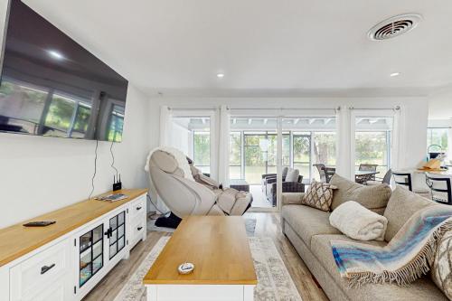 a living room with a couch and a table at The Flip Flop Stop in Naples