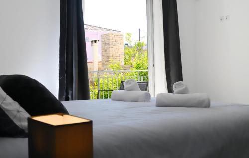 Ένα ή περισσότερα κρεβάτια σε δωμάτιο στο Grey family and friends apartment