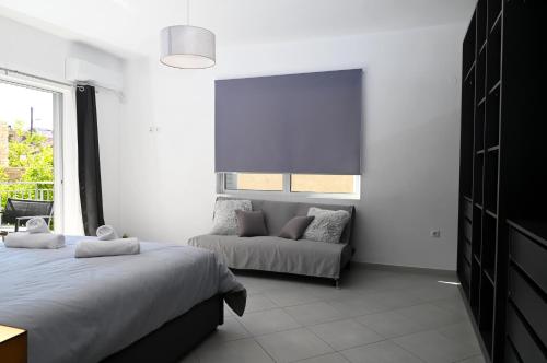 Ένα ή περισσότερα κρεβάτια σε δωμάτιο στο Grey family and friends apartment