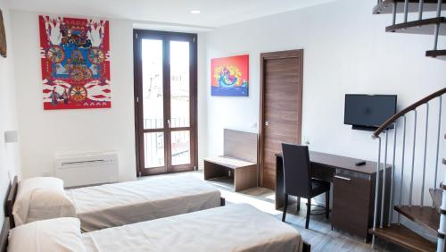Кровать или кровати в номере Apartments Porta di Castro