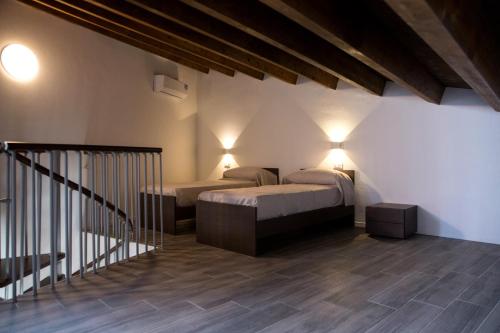 Кровать или кровати в номере Apartments Porta di Castro