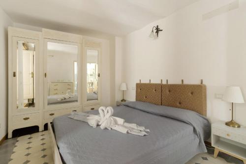 Una cama o camas en una habitación de Il Giostro 1 Biassa