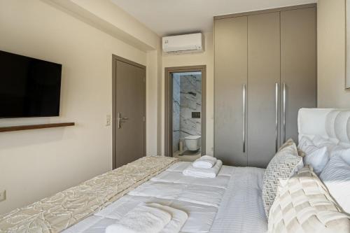 Ένα ή περισσότερα κρεβάτια σε δωμάτιο στο Elysian Villa 1 - With Private Pool