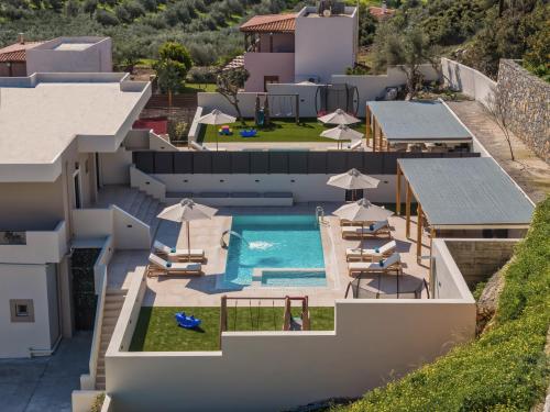 an aerial view of a house with a swimming pool at Elysian Villas - With 2 Private Pools in Roumelí