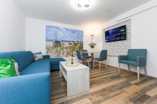 TV a/nebo společenská místnost v ubytování Strandkorb 6