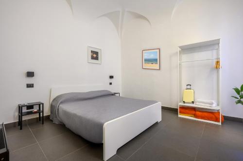 En eller flere senge i et værelse på Dimora Novecento