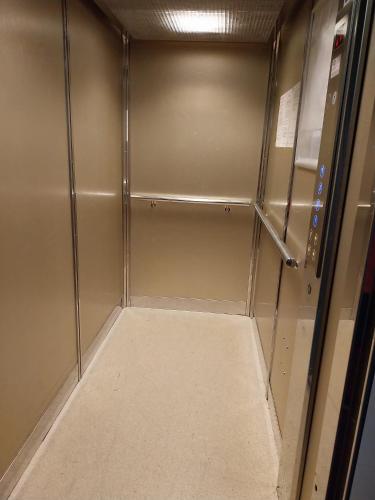 a walk in shower with a metal door at Wellness apartmán Frymburk D403 Čtvrté patro in Frymburk