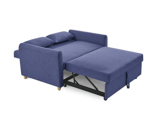 a blue sofa with a foot stool at le Cozy Bayeusain in Bayeux