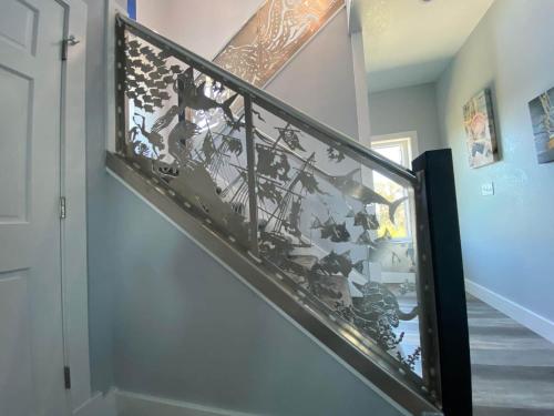 a stairway with a glass mosaic stair railing at Kokomo Sands in Hatteras