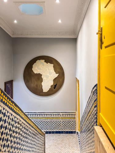 a room with a map on the wall at RIAD TANJA by chef Moha in Tangier