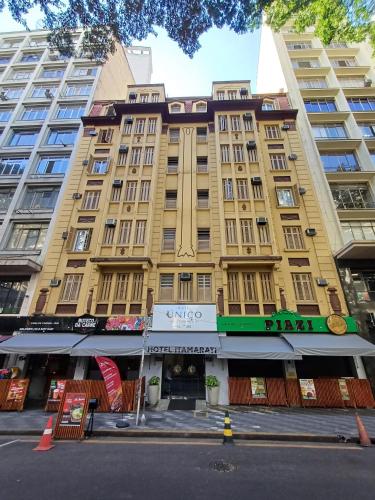 a large yellow building on a city street at Hotel Itamarati Centro-República in Sao Paulo