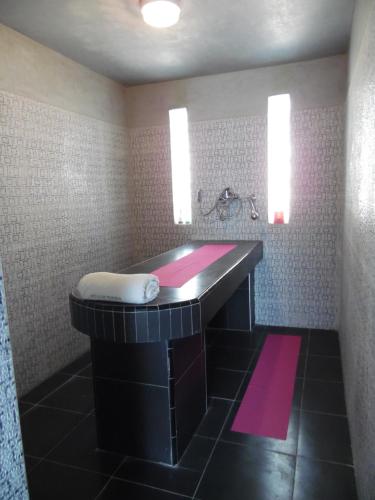 a bathroom with a large sink in a room at Villa Daba in Ghazoua