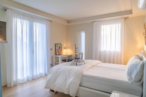 Ένα ή περισσότερα κρεβάτια σε δωμάτιο στο Rooms Le Rive 23