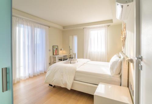 Ένα ή περισσότερα κρεβάτια σε δωμάτιο στο Rooms Le Rive 23