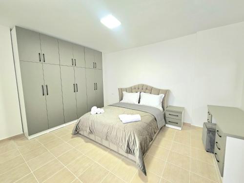 Ένα ή περισσότερα κρεβάτια σε δωμάτιο στο Dea's Apartments