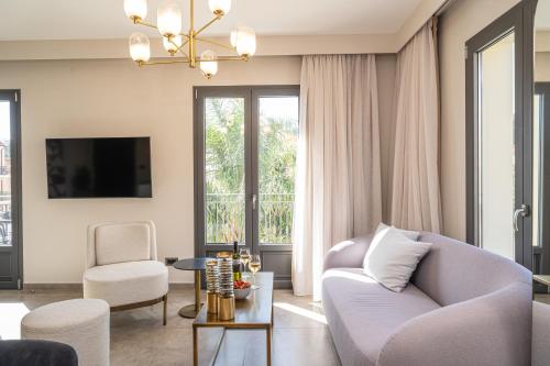 a living room with a couch and a table at PERATZADA central suite in Argostoli