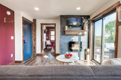 a living room with a couch and a fireplace at The Cove Guest House in Prescott