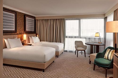 Un ou plusieurs lits dans un hébergement de l'établissement Hilton Vienna Park
