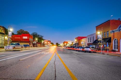 an empty city street at night with cars parked at The Cove Guest House in Prescott