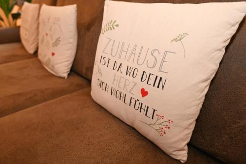 a pillow that saysurance isnt no design but your moral fault at Suite Sand-Düne in Warnemünde