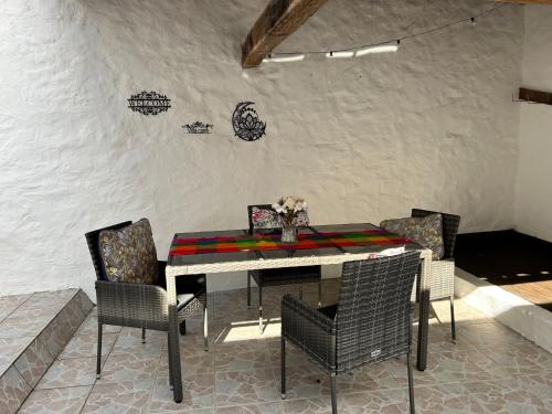 a dining room with a table and chairs at 1712Villacarre Holiday Gite in Le Dorat