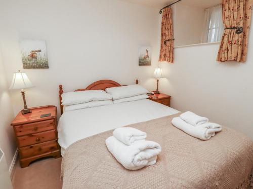 Voodi või voodid majutusasutuse Freesia Cottage toas