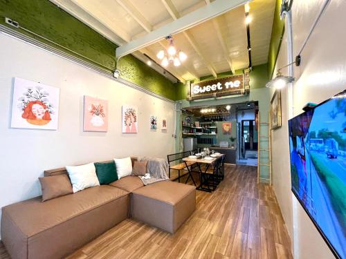 a living room with a couch and a table at Entire house,Unwind in the city, near GrandPalace in Bangkok