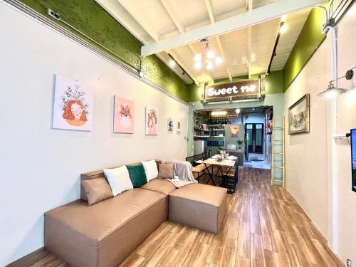 a living room with a couch and a table at Entire house,Unwind in the city, near GrandPalace in Bangkok