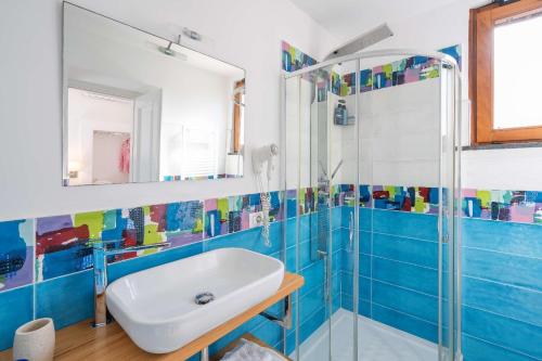 a bathroom with a sink and a shower at L'antica Pigna Chateau in Vico Equense
