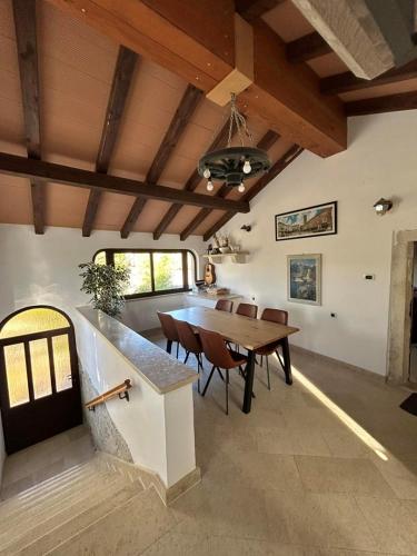 a dining room with a wooden table and chairs at Casa Anka in Gračišće