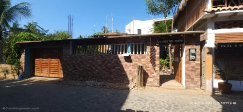 a brick building with a entrance to a building at La casa del sueño in Mazunte