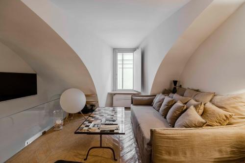 a living room with a couch and a table at Piazza Navona Luxury Loft in Rome