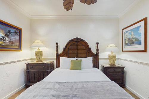a bedroom with a large bed with two night stands at Kaha Lani 104 in Lihue
